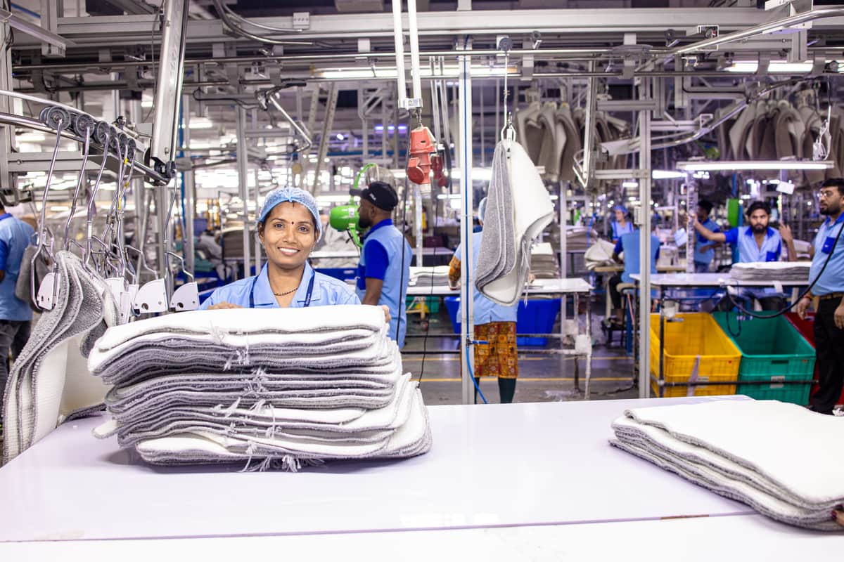 A garment printing machine running a shirt