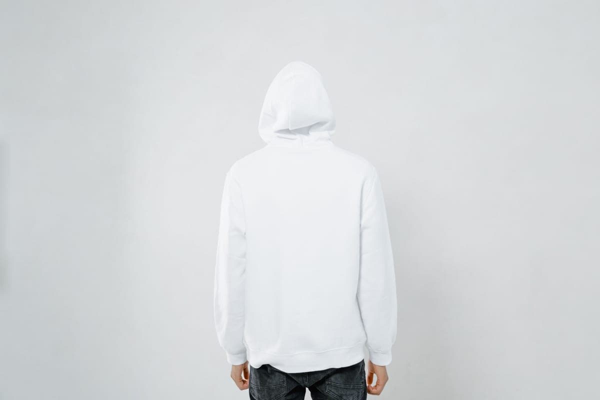 A plain hooded sweatshirt laid flat