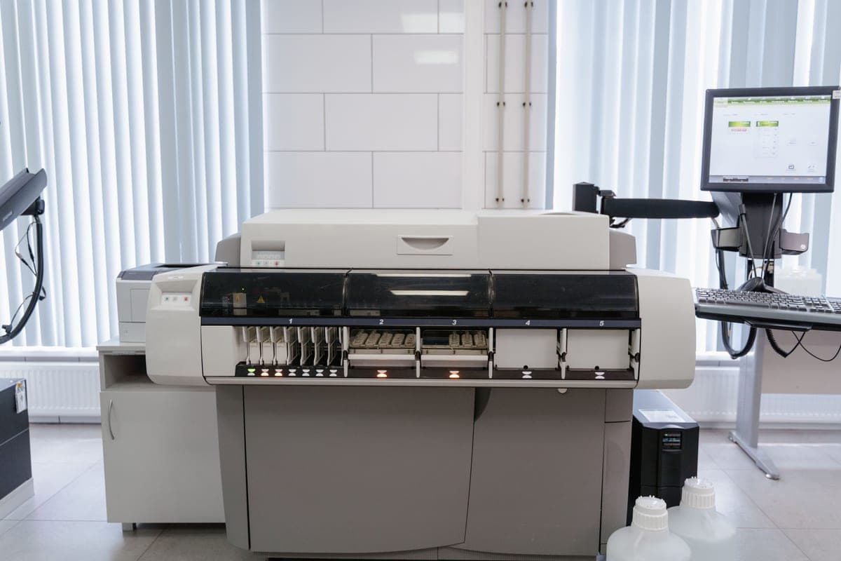 A wide-format printer feeding out a large sheet