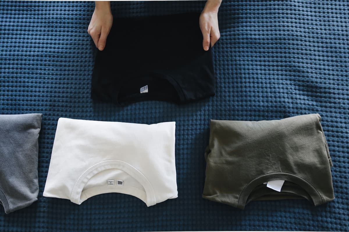 A stack of folded blank t-shirts