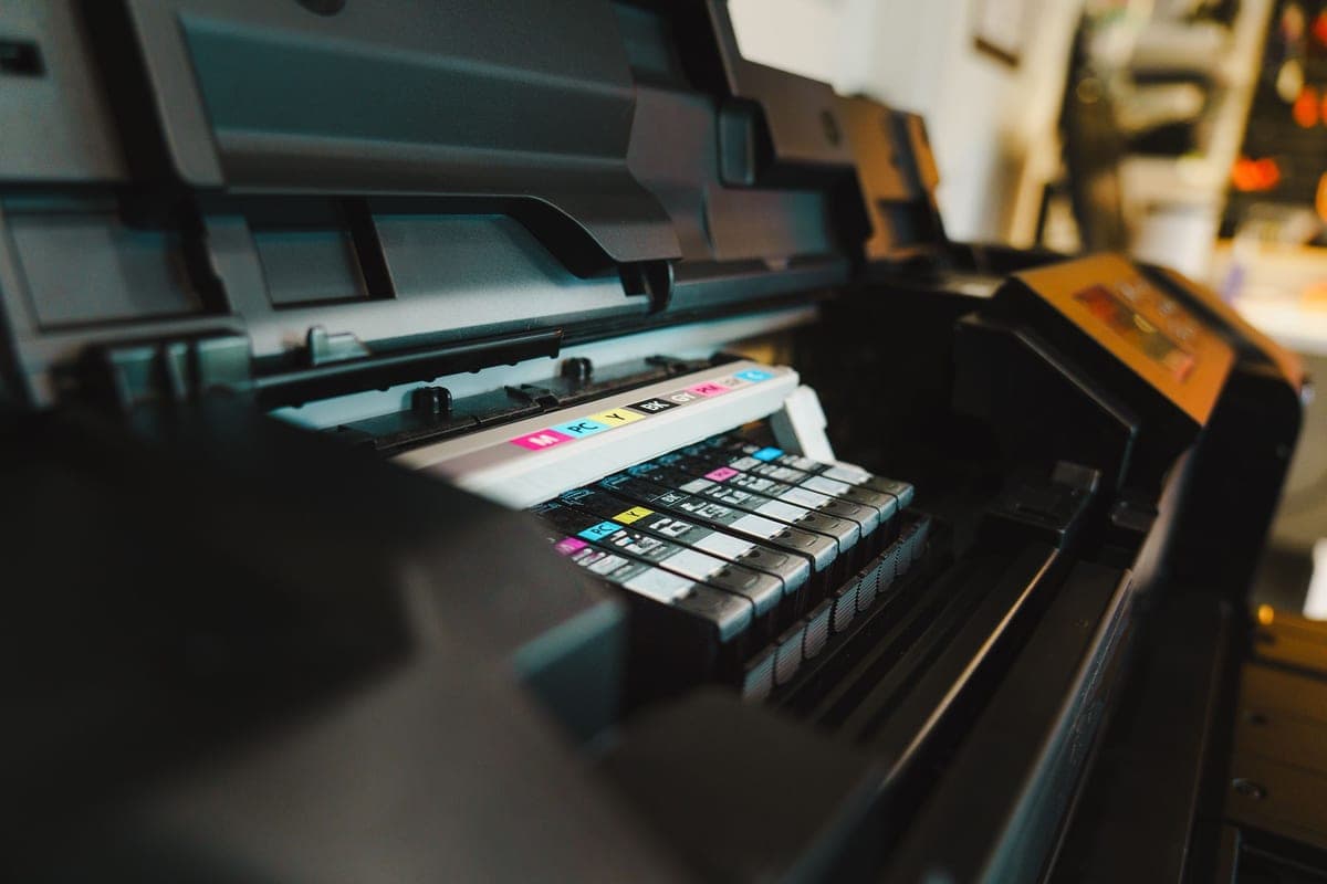 An inkjet printer feeding out a printed sheet